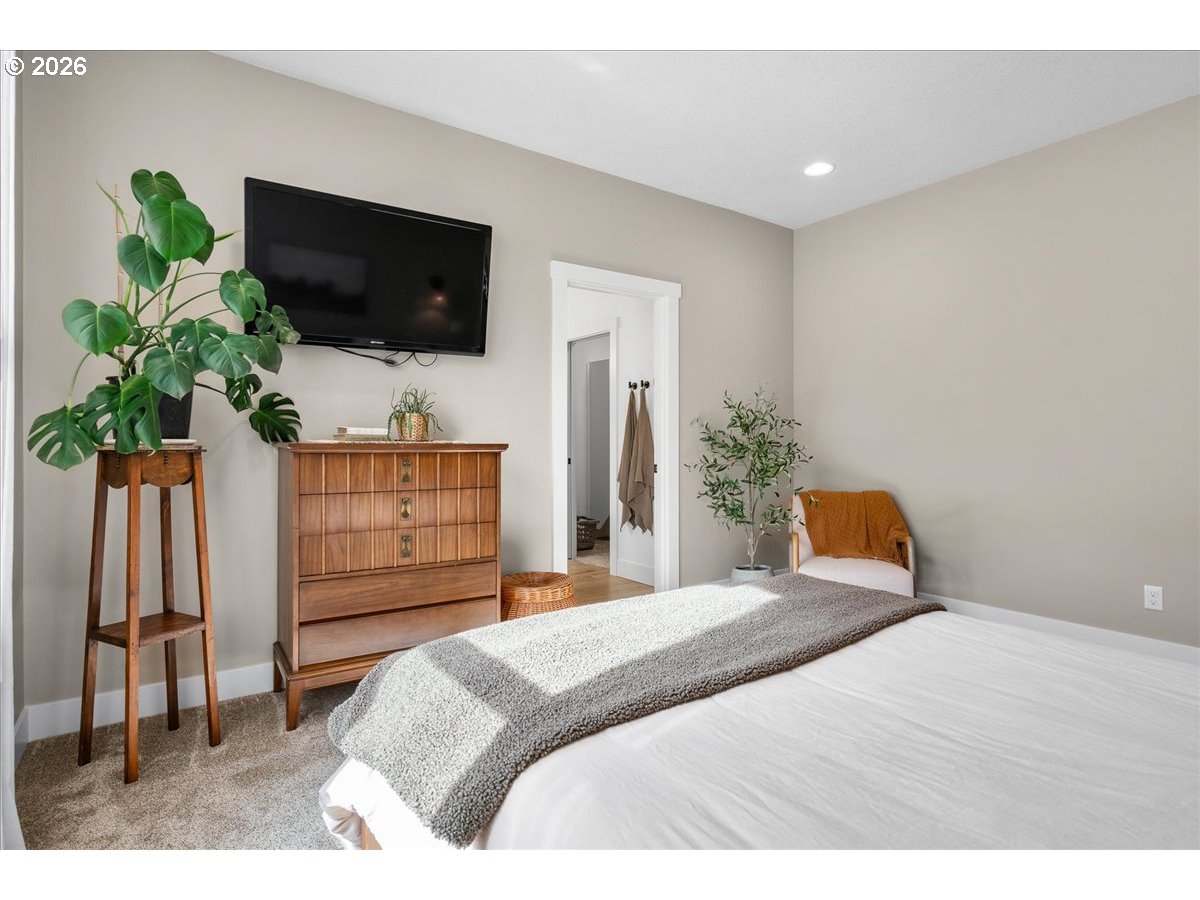 1305 Uff Da Street Silverton, OR 97381 - Photo 25 of 46 a bedroom with a bed and a flat screen tv