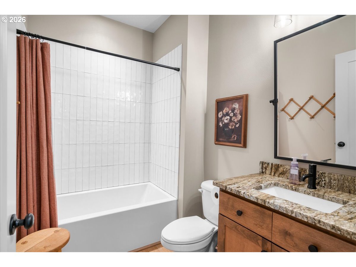 1305 Uff Da Street Silverton, OR 97381 - Photo 33 of 46 a bathroom with a granite countertop sink a toilet and shower