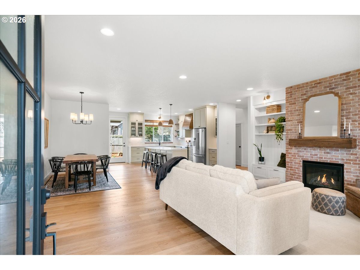 1305 Uff Da Street Silverton, OR 97381 - Photo 5 of 46 a living room with furniture wooden floor and a fireplace