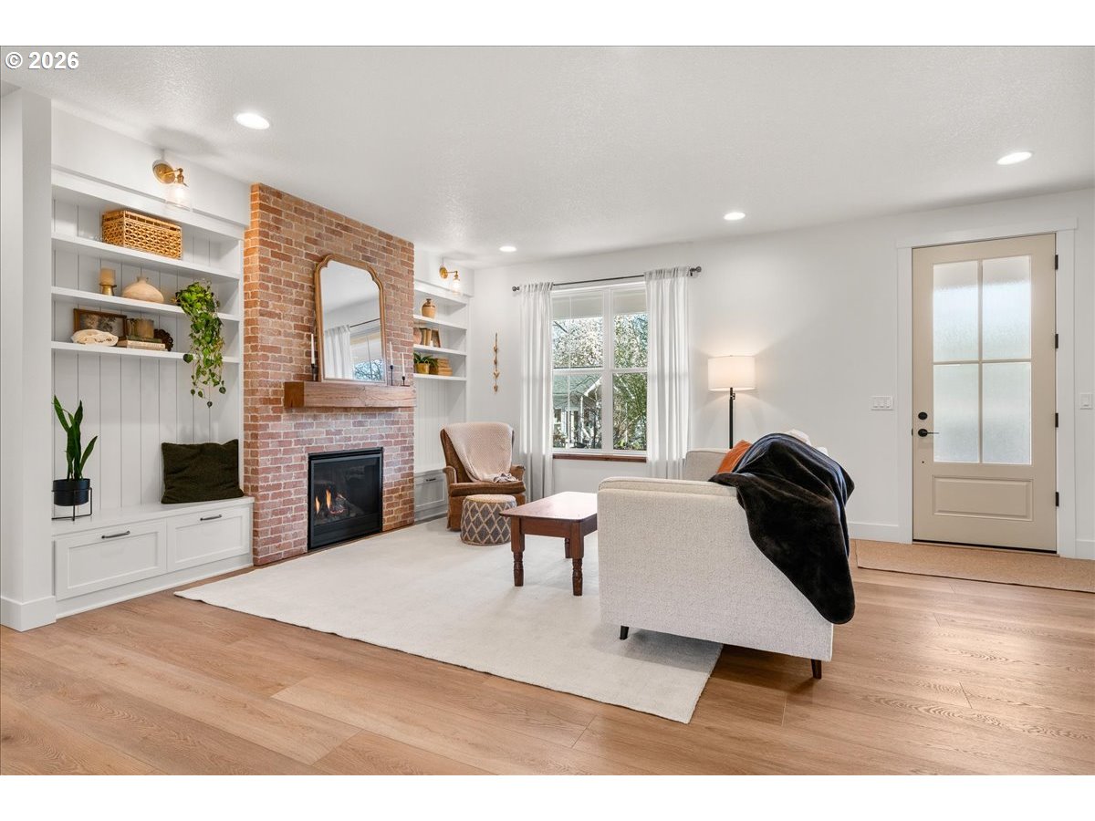 1305 Uff Da Street Silverton, OR 97381 - Photo 7 of 46 a living room with furniture and a fireplace