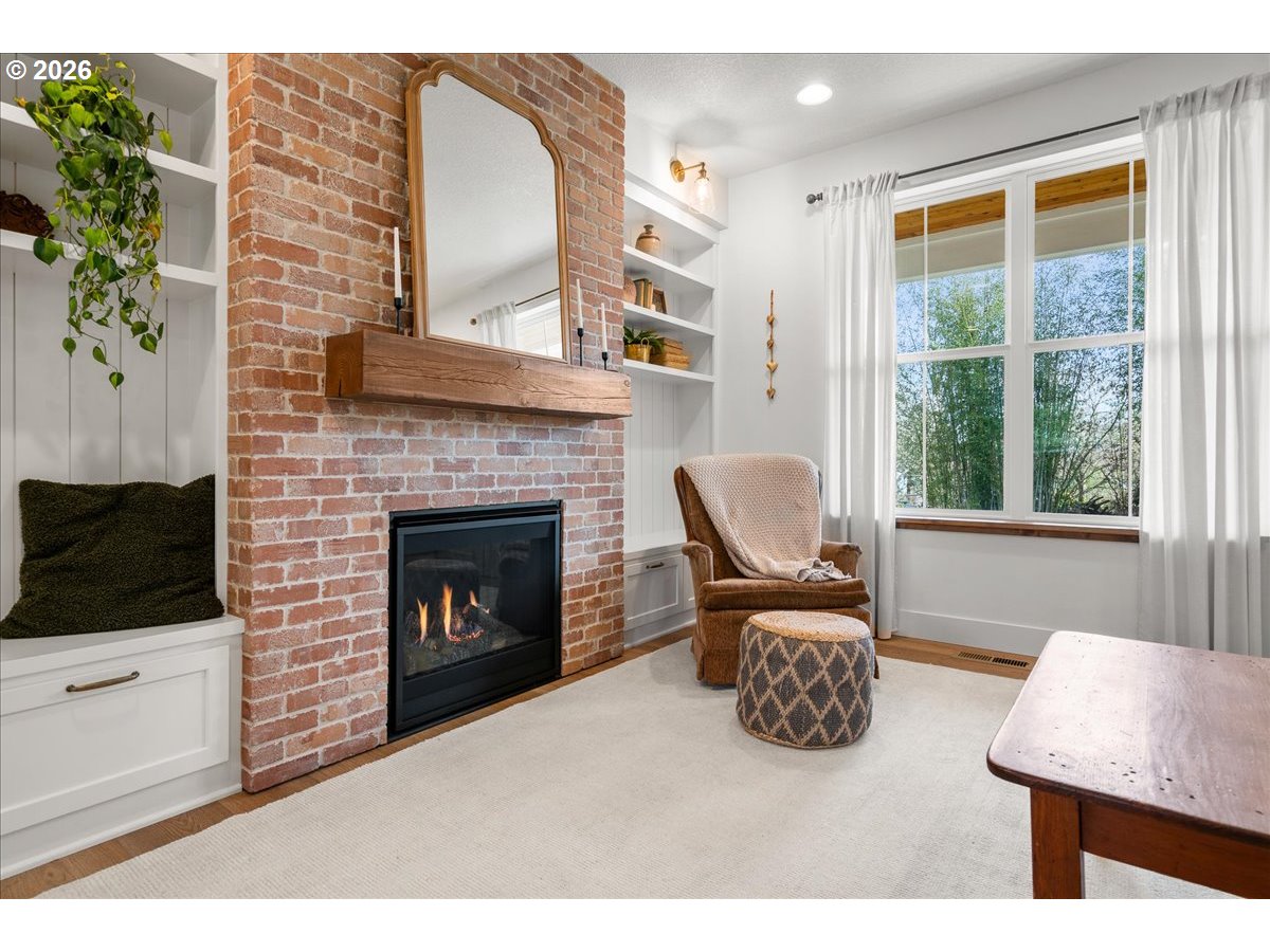 1305 Uff Da Street Silverton, OR 97381 - Photo 9 of 46 a living room with furniture a flat screen tv and a fireplace