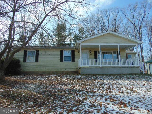 3623 Carrollton Road Upperco, MD 21155 - Photo 1 of 20 a front view of a house with a garden