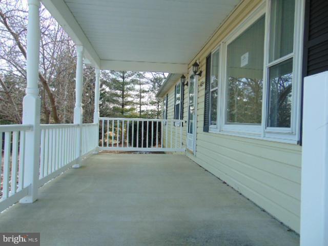 3623 Carrollton Road Upperco, MD 21155 - Photo 2 of 20 a view of a porch with wooden floor and outdoor space