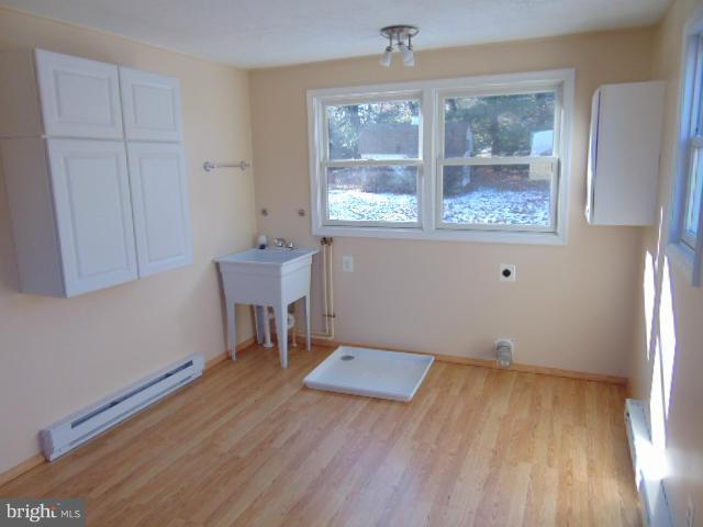 3623 Carrollton Road Upperco, MD 21155 - Photo 11 of 20 wooden floor in an empty room with a window