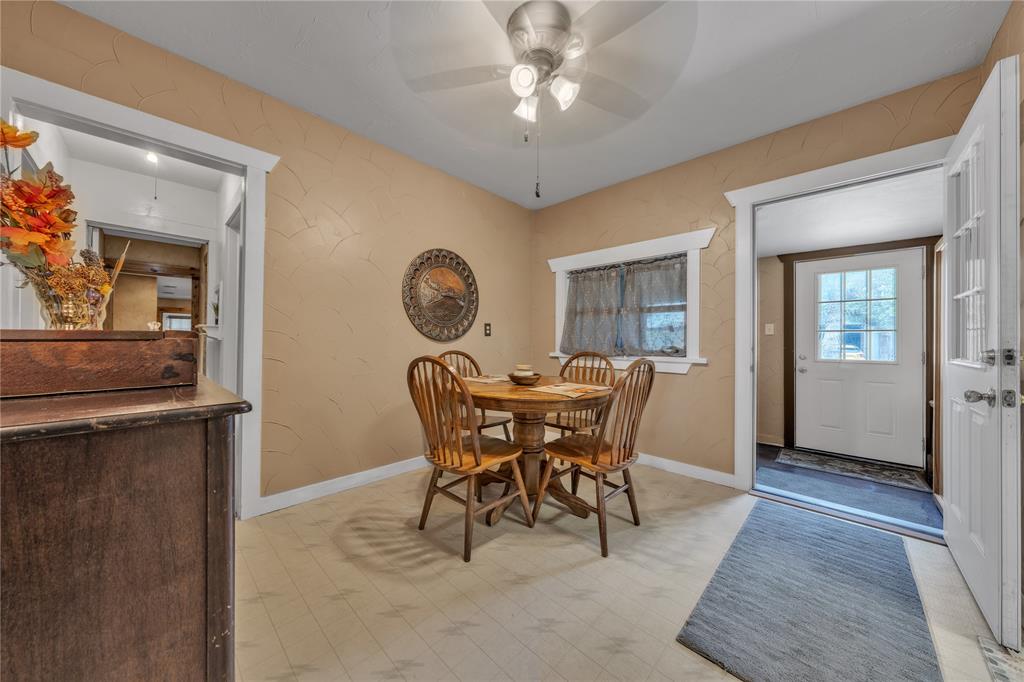 209 Dixie Road Millsap, TX 76066 - Photo 19 of 31 a view of a dining room with furniture and chandelier