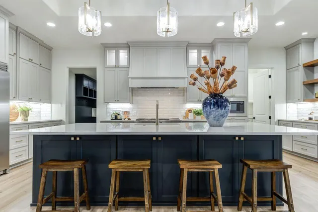 a kitchen with stainless steel appliances a sink and cabinets