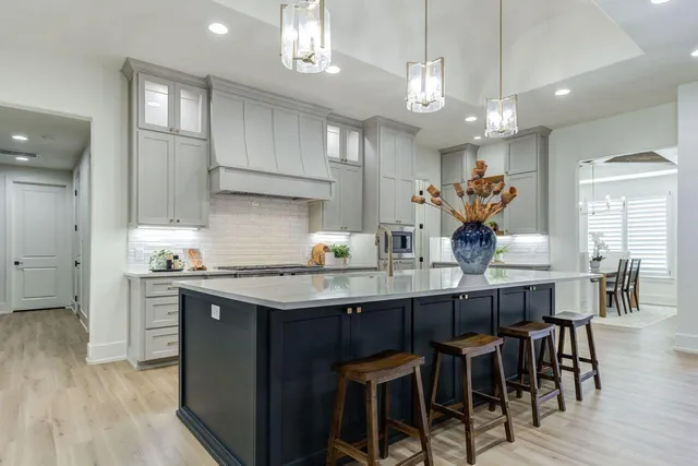 a kitchen with lots of counter space and dining table