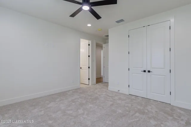 a view of an empty room with a fireplace
