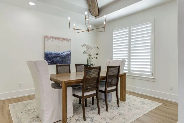 a view of a dining room with furniture and window