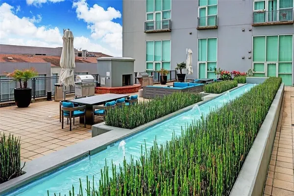 a outdoor space with patio fireplace and a couch