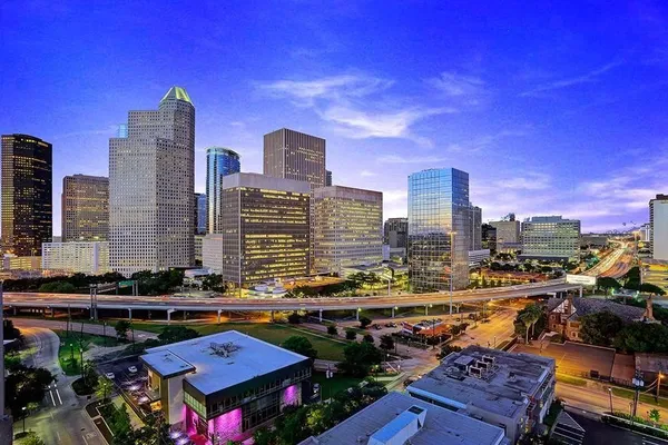 a view of a city with tall buildings