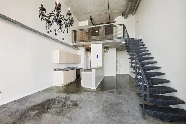 a kitchen with a stove a sink and a refrigerator