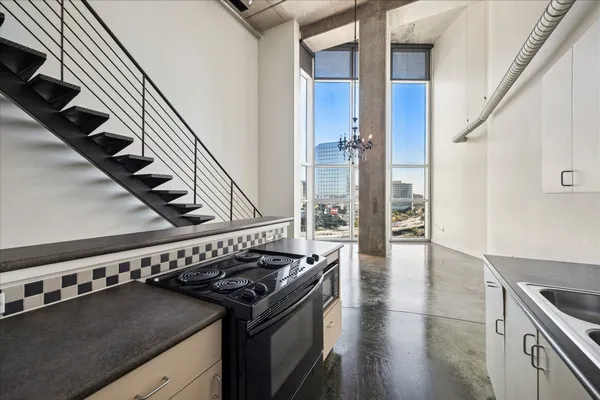 a kitchen with a stove and a refrigerator