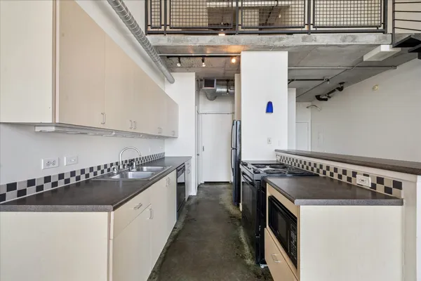 a bathroom with a sink toilet and a mirror