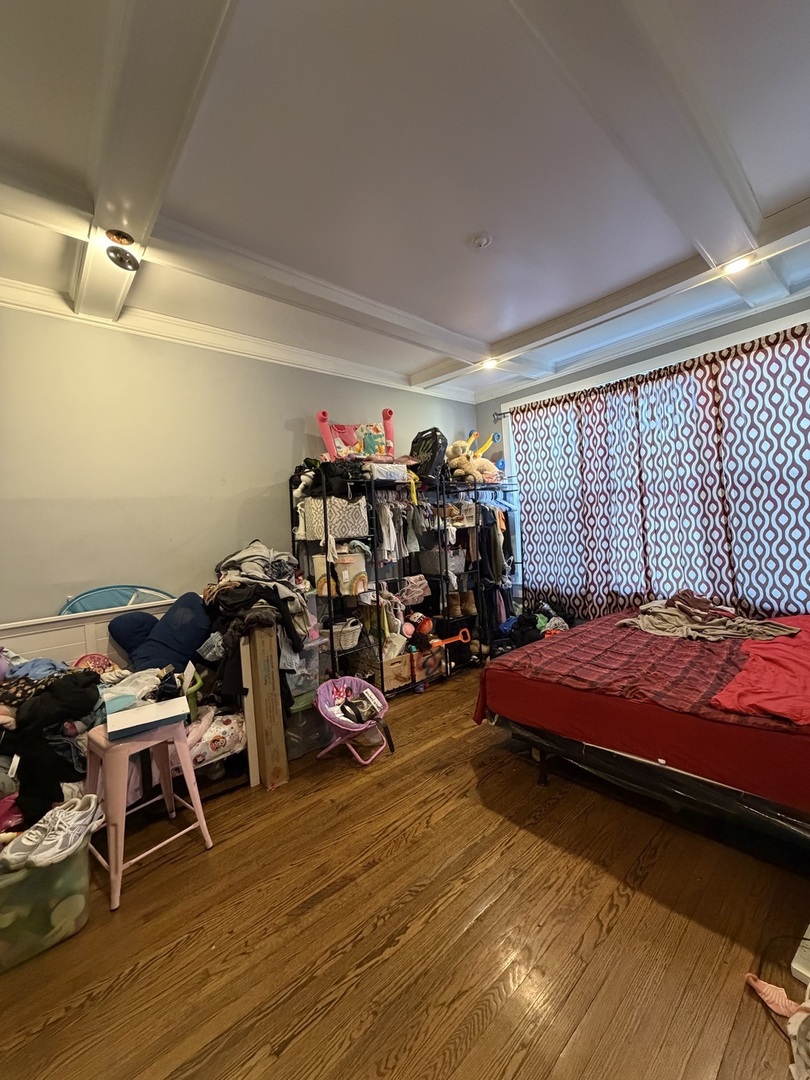 6156 South Indiana Avenue Chicago, IL 60637 - Photo 11 of 21 a bedroom with furniture and a window