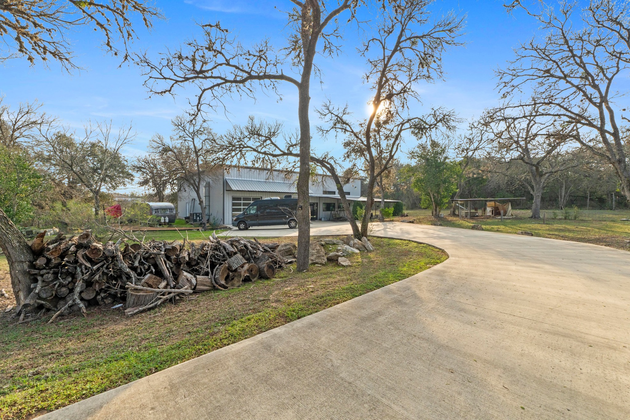 12302 Bethel Church Road Manchaca, TX 78652 - Photo 25 of 35 View of front of property featuring curved driveway