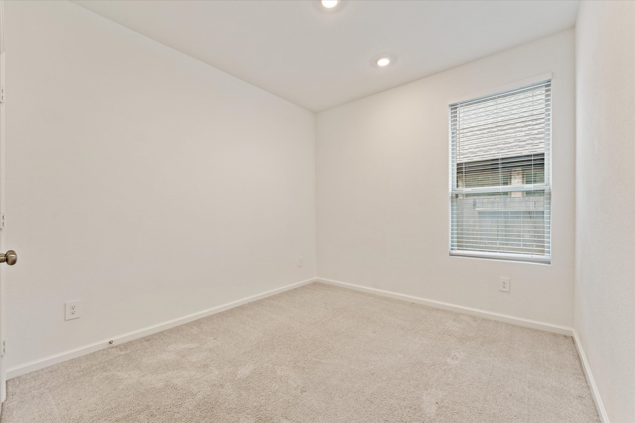 15520 Sunset Maple Court Conroe, TX 77302 - Photo 22 of 47 an empty room with a window