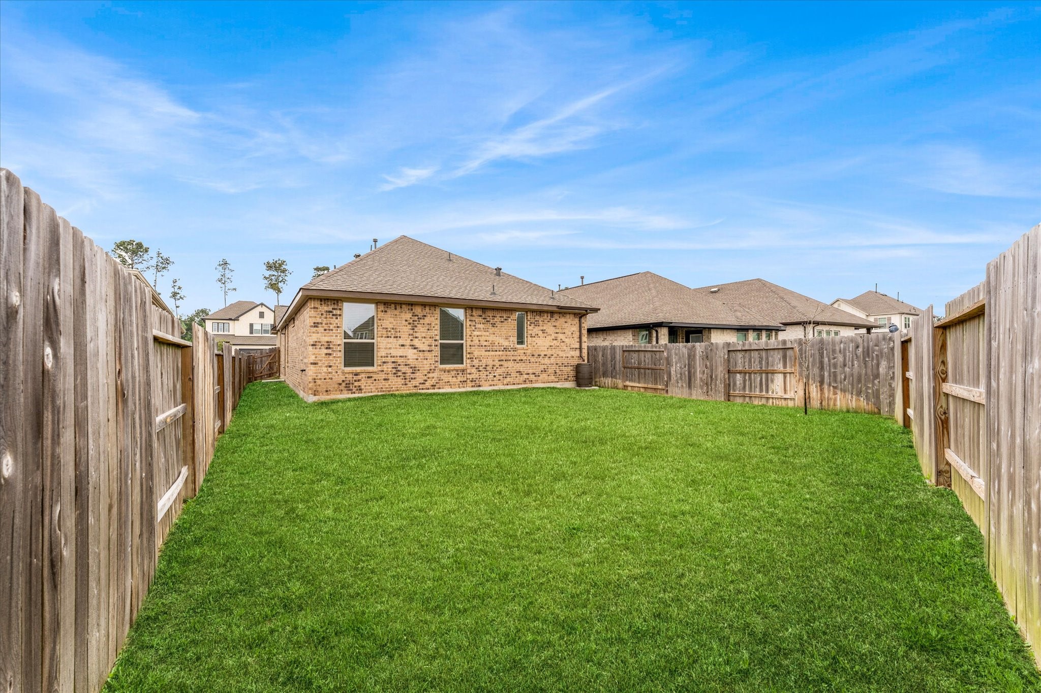 15520 Sunset Maple Court Conroe, TX 77302 - Photo 29 of 47 a view of a yard in front of a house