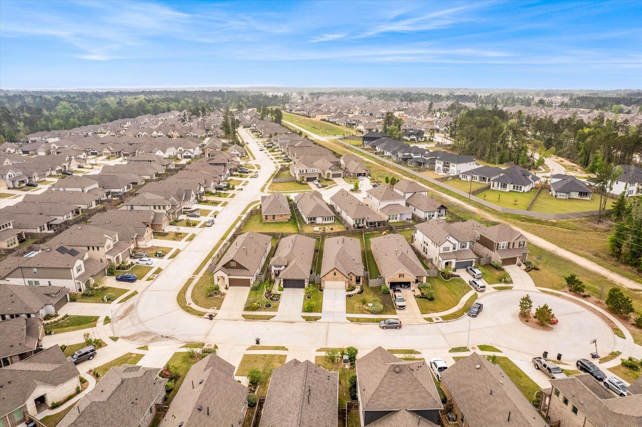 15520 Sunset Maple Court Conroe, TX 77302 - Photo 40 of 47 an aerial view of residential houses with outdoor space