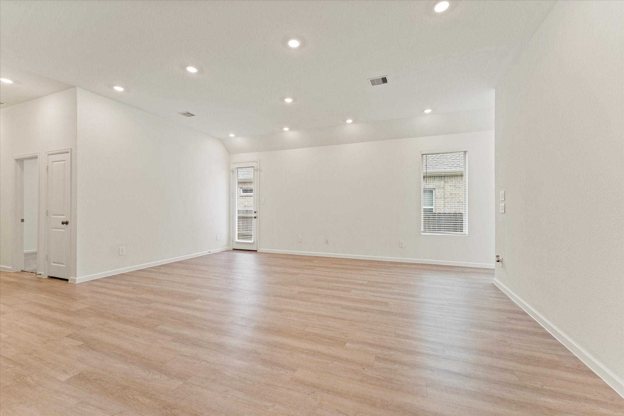 15520 Sunset Maple Court Conroe, TX 77302 - Photo 9 of 47 a view of an empty room with wooden floor