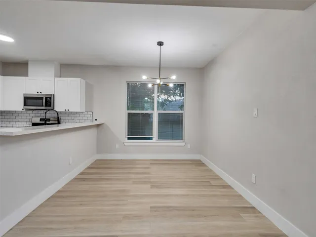 a view of a kitchen with granite countertop granite top and a stove