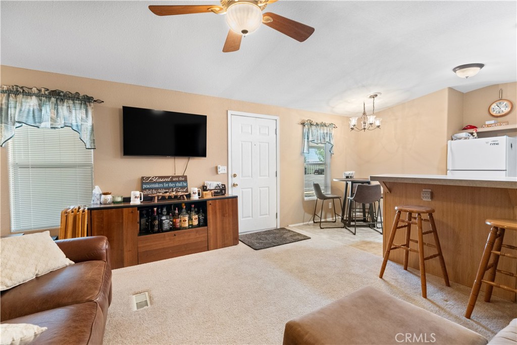5900 Colorado River Road, Unit 18 Blythe, CA 92225 - Photo 10 of 58 a living room with furniture and a flat screen tv