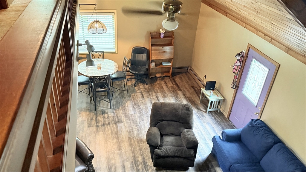 1755 Maple Street Dighton, MA 02764 - Photo 13 of 23 a living room with furniture and a floor to ceiling window