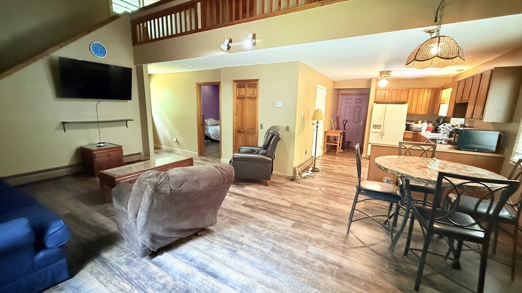 1755 Maple Street Dighton, MA 02764 - Photo 9 of 23 a living room with furniture and a flat screen tv