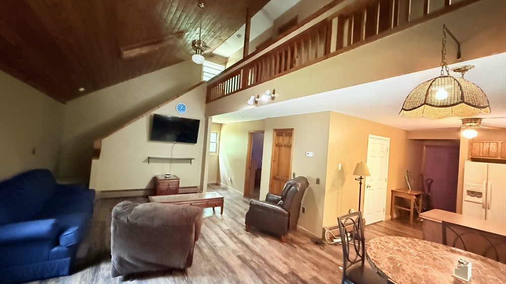 1755 Maple Street Dighton, MA 02764 - Photo 10 of 23 a living room with furniture and a flat screen tv