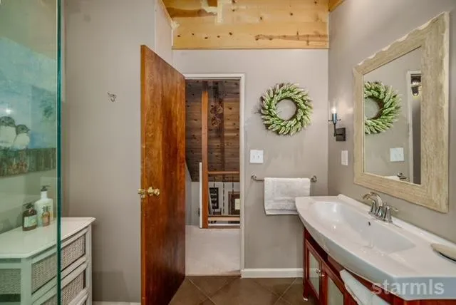 a patio with a table and chairs