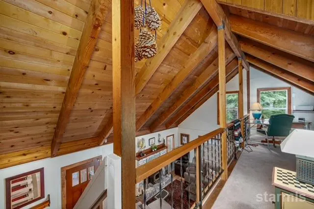 a bedroom with furniture and a baby crib