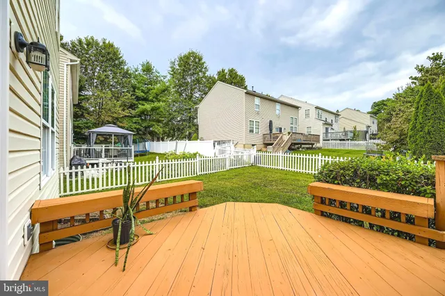 swimming pool with outdoor seating and garden