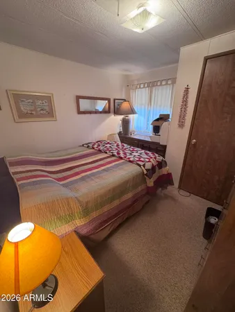 a bedroom with a bed and window