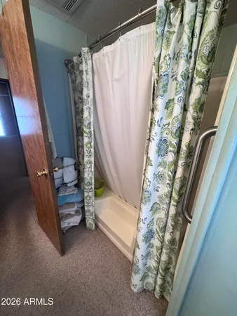 a view of walk in closet with window