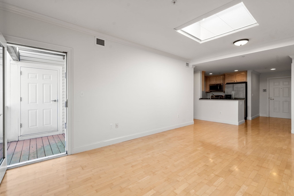 121 Centre Street, Unit PH3 Brookline, MA 02446 - Photo 13 of 32 an empty room with a bathroom and a sink