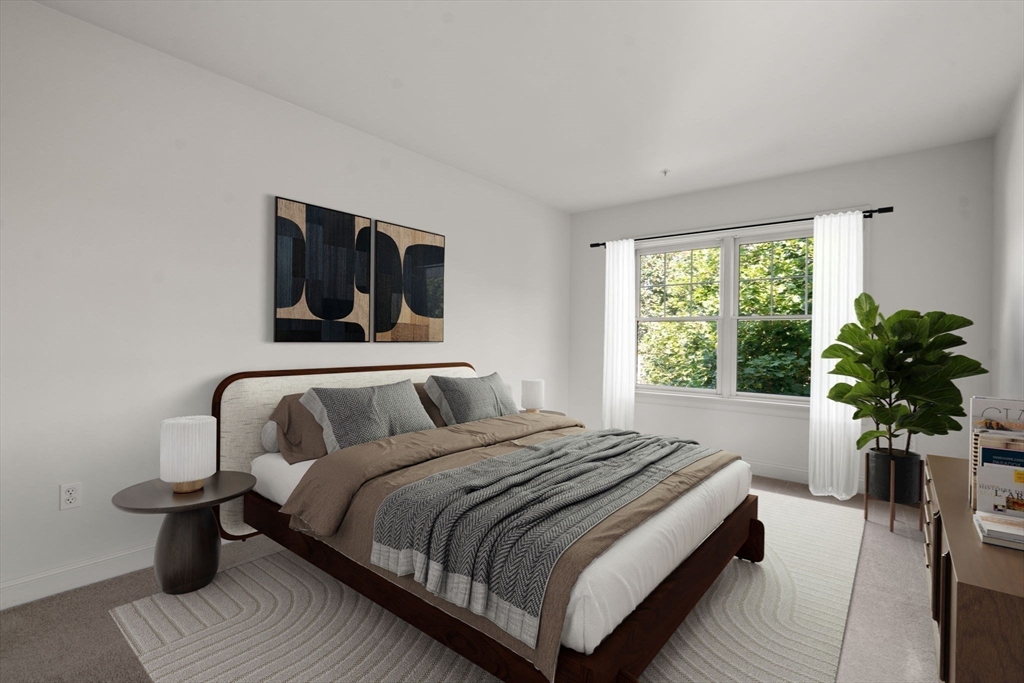 121 Centre Street, Unit PH3 Brookline, MA 02446 - Photo 16 of 32 a bedroom with bed and a potted plant