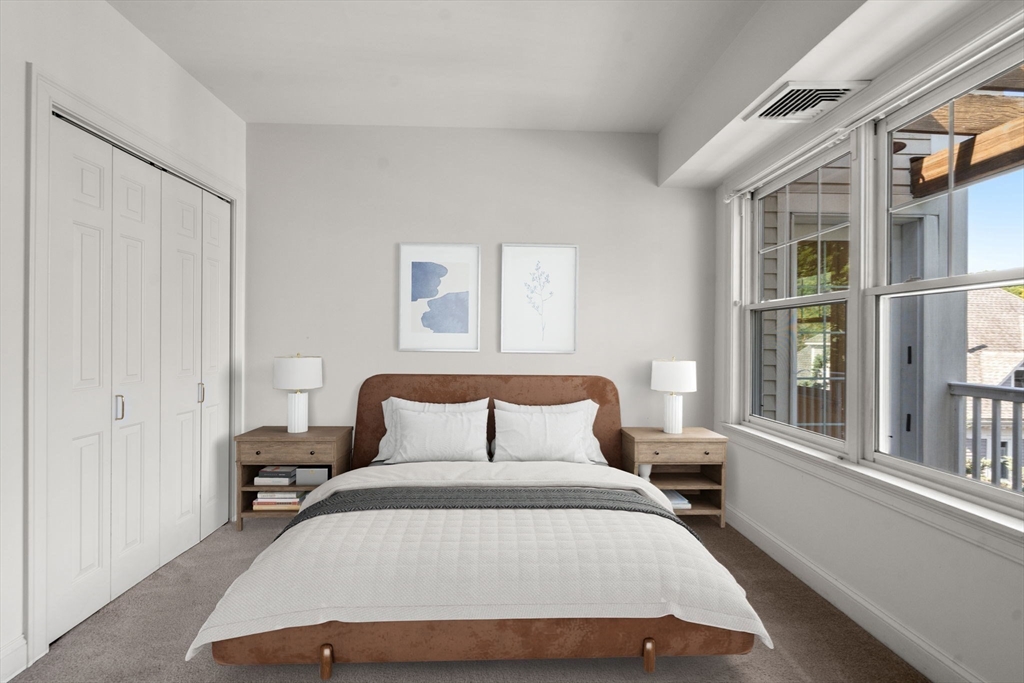 121 Centre Street, Unit PH3 Brookline, MA 02446 - Photo 22 of 32 a bedroom with a bed and window