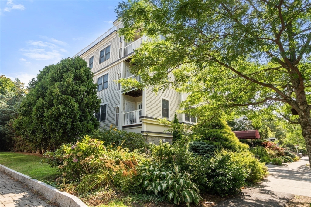 121 Centre Street, Unit PH3 Brookline, MA 02446 - Photo 30 of 32 a view of a house with a yard
