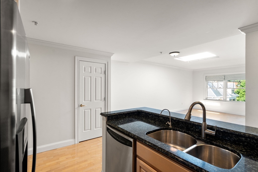 121 Centre Street, Unit PH3 Brookline, MA 02446 - Photo 7 of 32 a close view of sink and tap