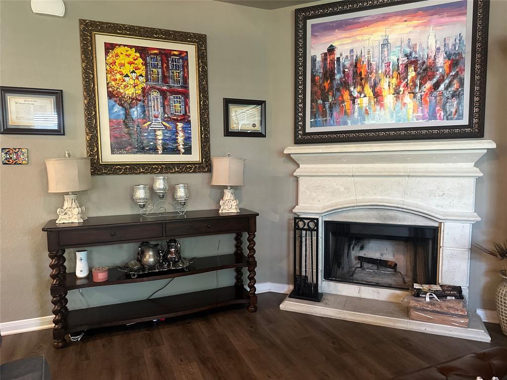 10420 Langham Drive Waco, TX 76708 - Photo 11 of 36 a living room with furniture and a fireplace