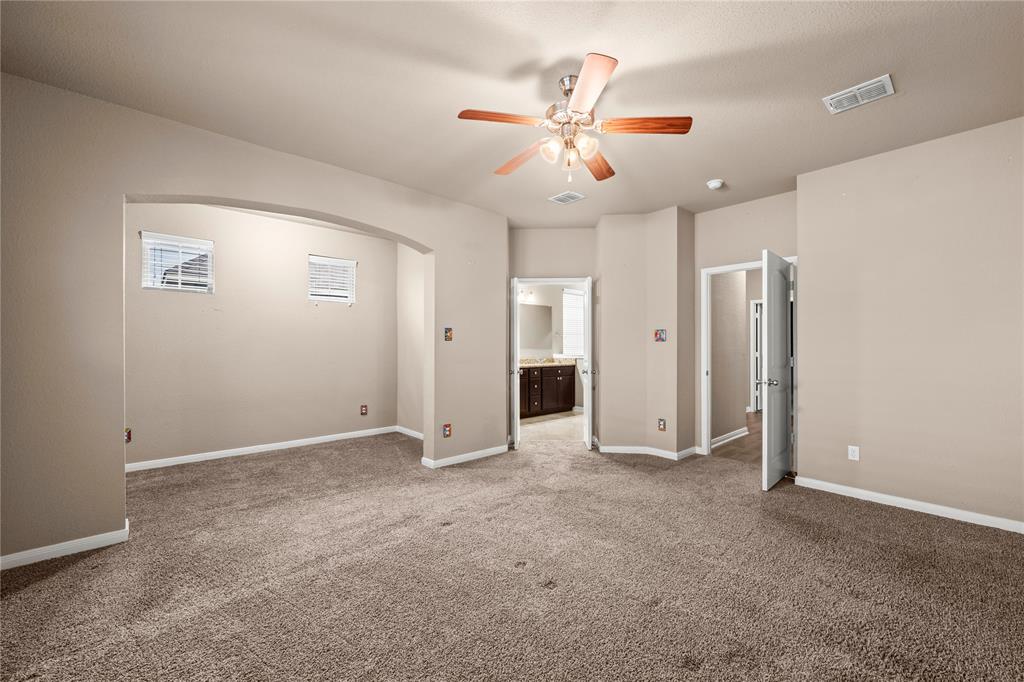 10420 Langham Drive Waco, TX 76708 - Photo 15 of 36 a view of an empty room with a ceiling fan