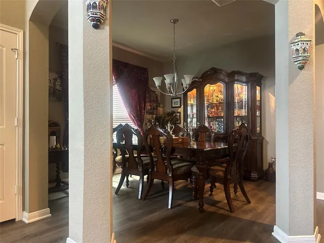 a view of a dining room with furniture and window