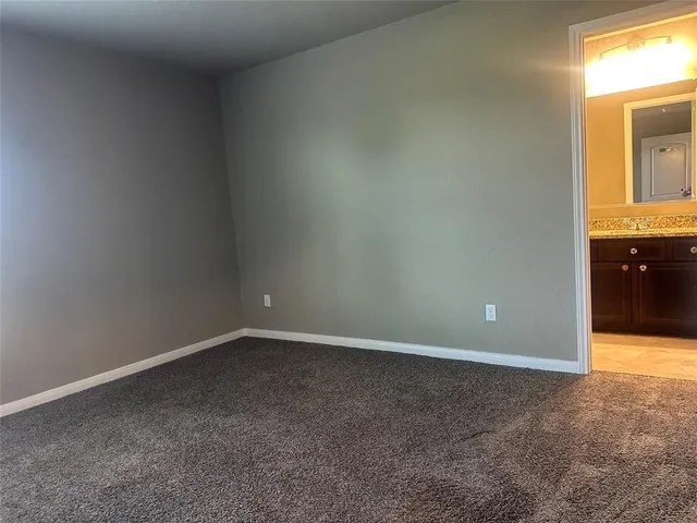 a view of an empty room and a window