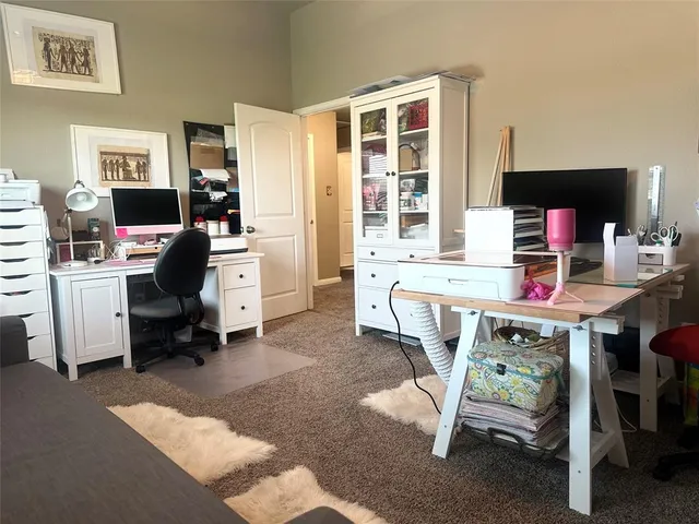 a workspace with furniture and a flat screen tv
