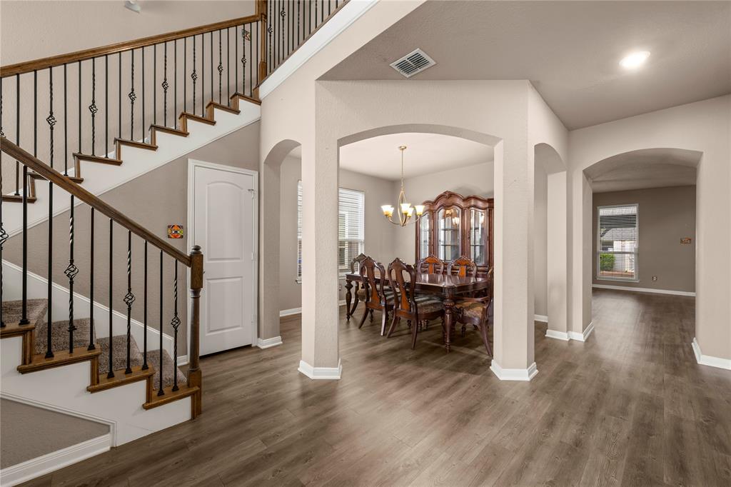 10420 Langham Drive Waco, TX 76708 - Photo 4 of 36 a view of entryway with dining room and wooden floor