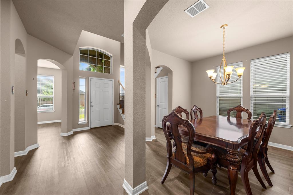 10420 Langham Drive Waco, TX 76708 - Photo 5 of 36 a view of a dining room with furniture window and wooden floor