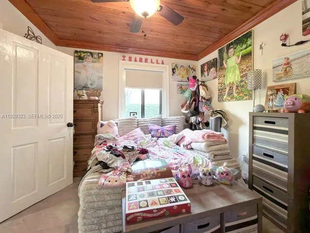 a bathroom with a sink a toilet and a shower curtain