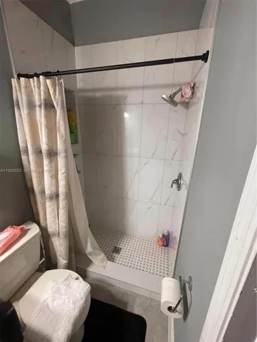 a aerial view of a house with a yard