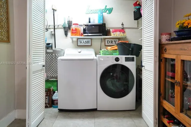 a view of a fountain in the garden from a balcony