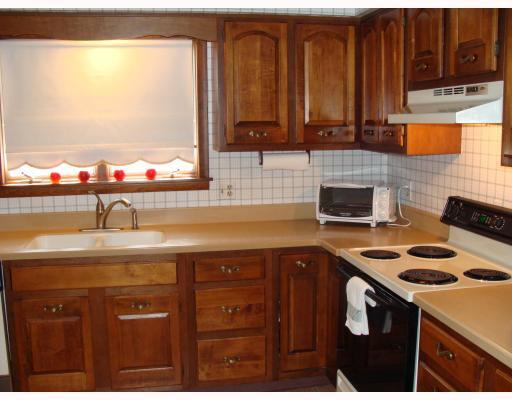 111 Redcut Lodge Road Latrobe, PA 15650 - Photo 11 of 18 Kitchen. Kitchen with all wood cabinets and solid surface counter top.